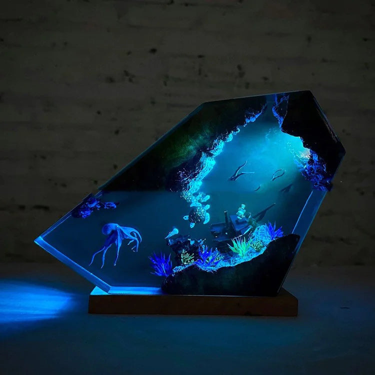 Glowing underwater scene with fish and coral in a hexagonal tank against a dark background
