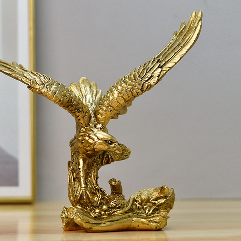 Golden eagle figurine perched atop a book, with a detailed and textured background.
