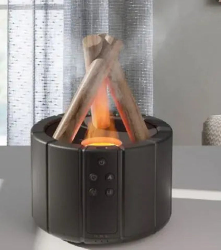 Portable fire pit with glowing embers and wooden logs on a gray surface.