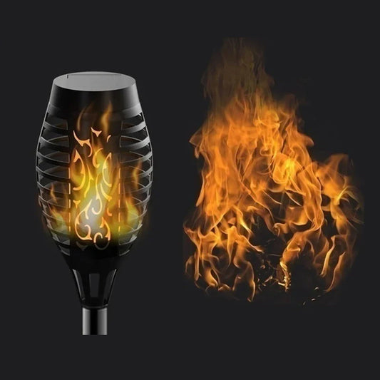 Black outdoor torch with flames on a black background